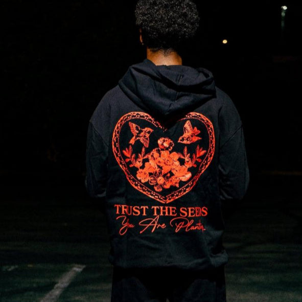 
                      
                        TRUST THE SEEDS HOODIE
                      
                    